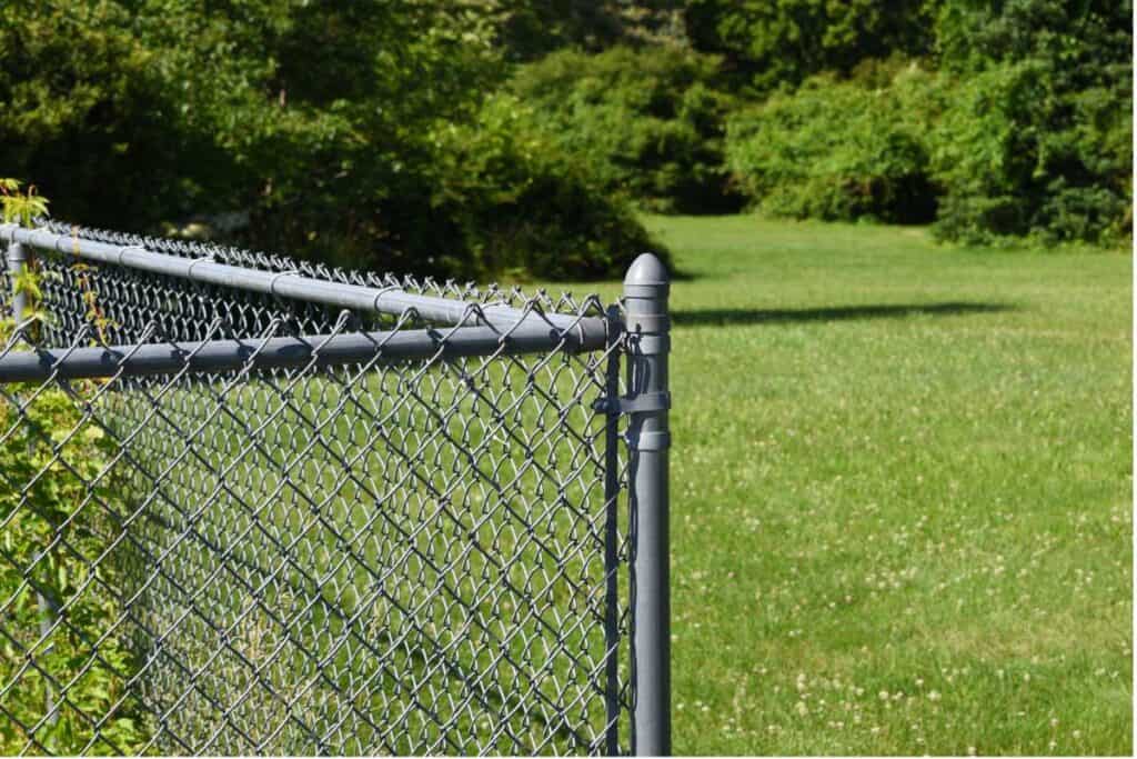 Chain Link Fence. There's More Than 2 Sides Of The Simple Neighborhood Fence