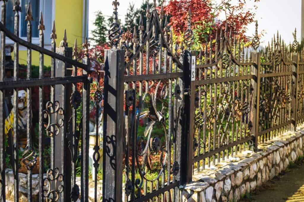 Wrought Iron Fence. There's More Than 2 Sides Of The Simple Neighborhood Fence